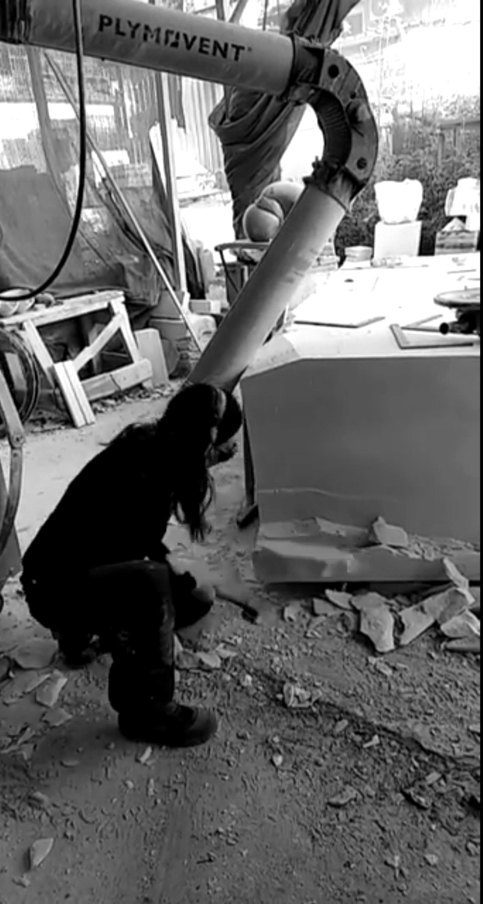Yoko Kubrick hand-carving marble in the Pietrasanta studio