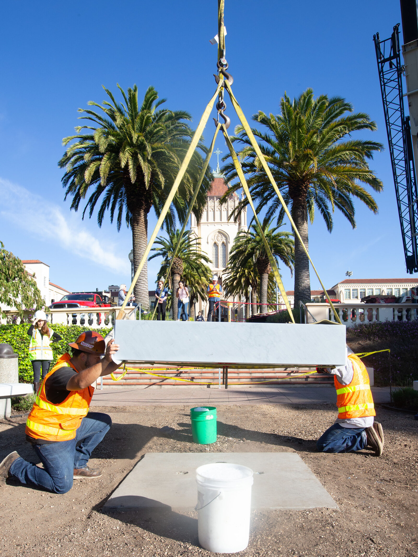 The Bardiglio Imperiale marble base being installed over the prepared foundation