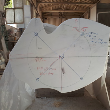 The marble base of Lethe in the workshop, marked up with measurements and pin-hole locations for installation