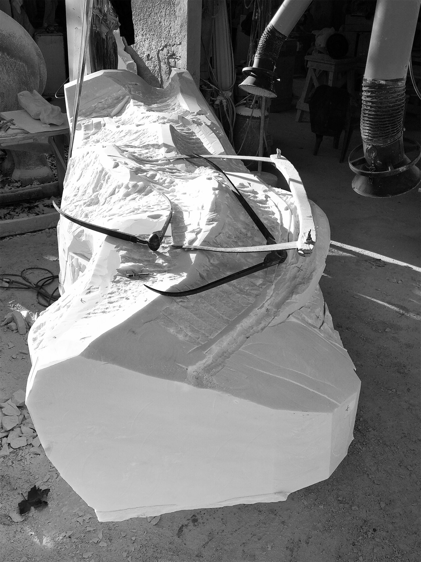 Roughing out a marble form with calipers in the workshop